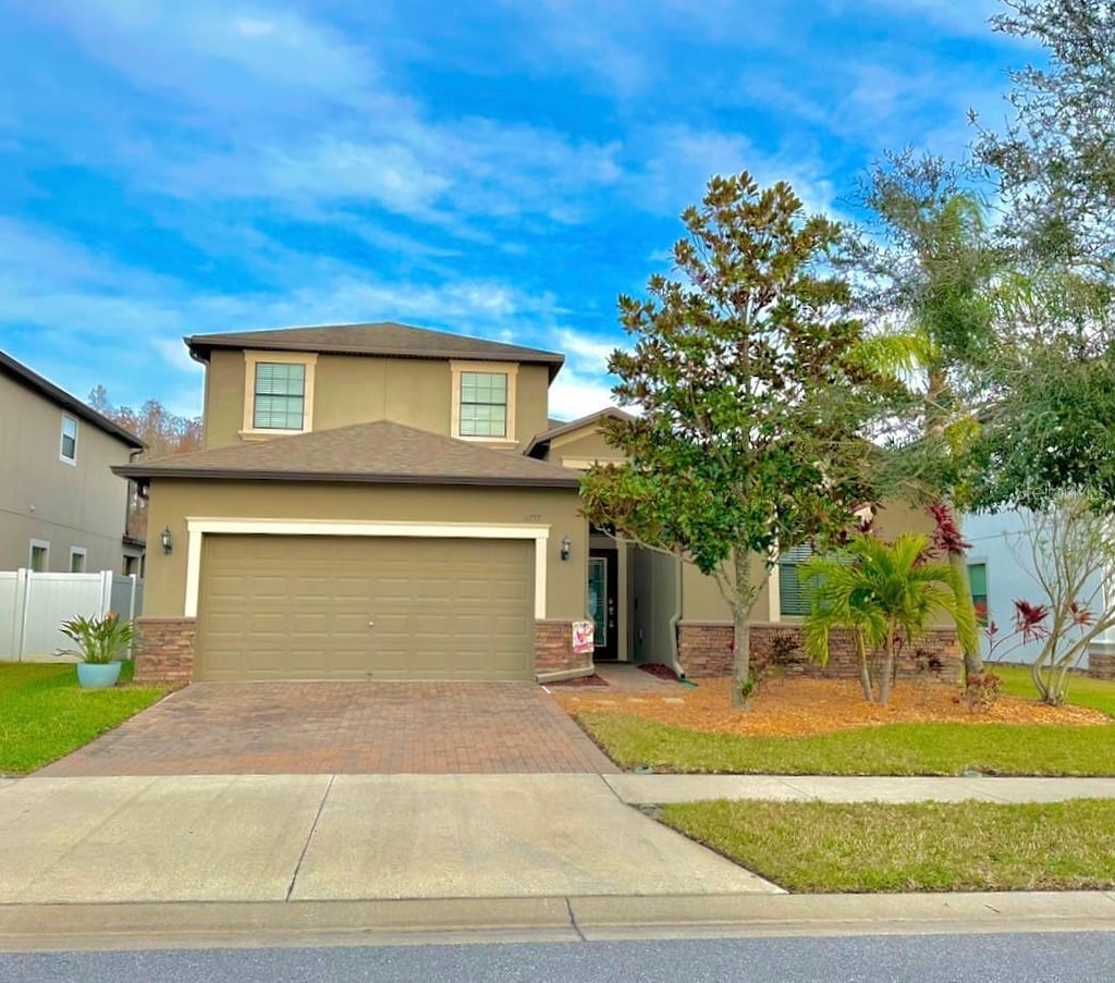 view of front of property with a garage