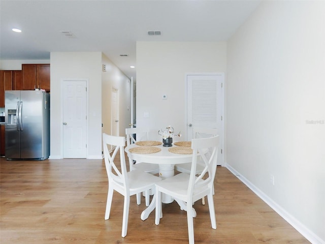 dining room featuring light hardwood / wood-style flooring