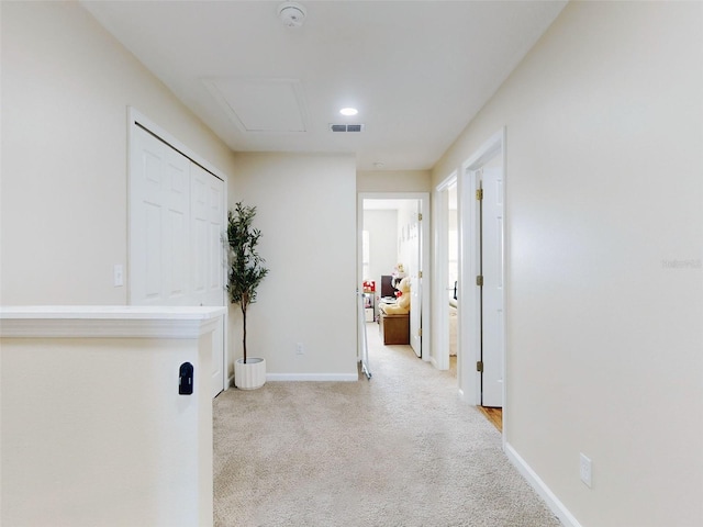 hallway with light carpet