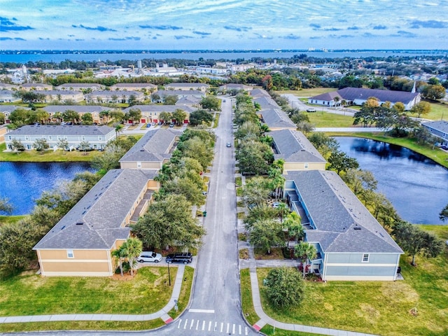 birds eye view of property with a water view