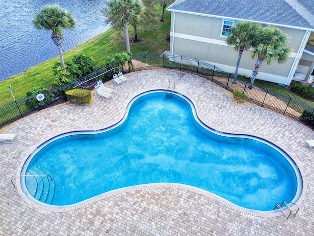 view of pool with a water view