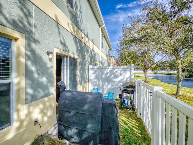 view of property exterior featuring a water view