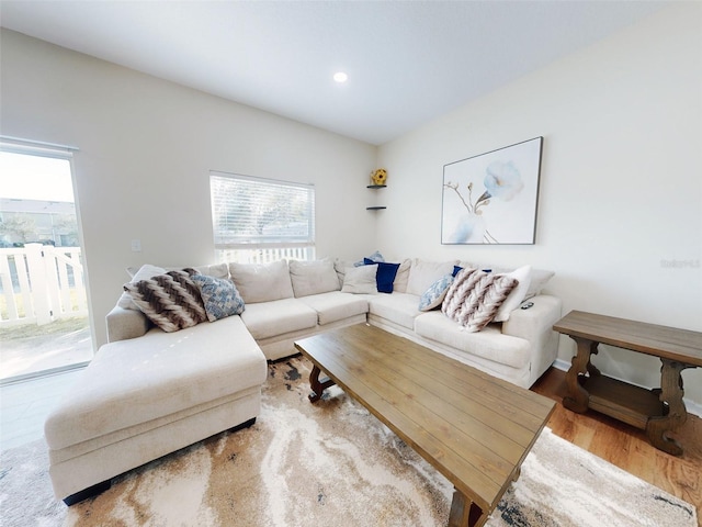 2775 Revolution St Unit 103, Melbourne, FL 32935 - living area featuring wood finished floors, recessed lighting, and a healthy amount of sunlight