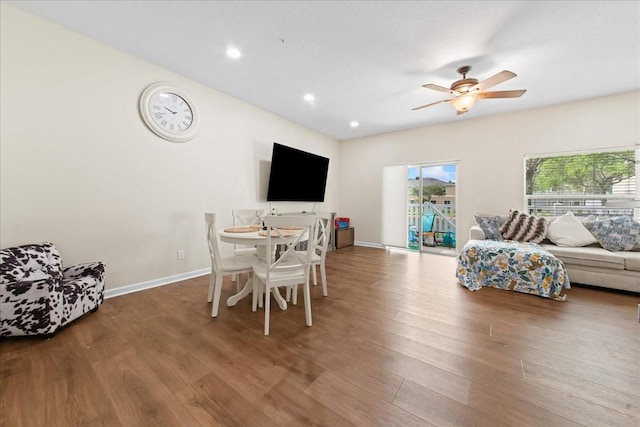 2775 Revolution St Unit 103, Melbourne, FL 32935 - living area with wood finished floors, ceiling fan, recessed lighting, and baseboards