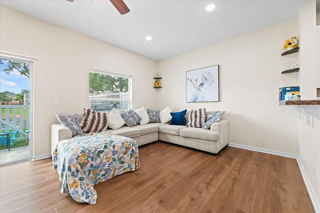 2775 Revolution St Unit 103, Melbourne, FL 32935 - living area with recessed lighting, a ceiling fan, wood finished floors, and baseboards