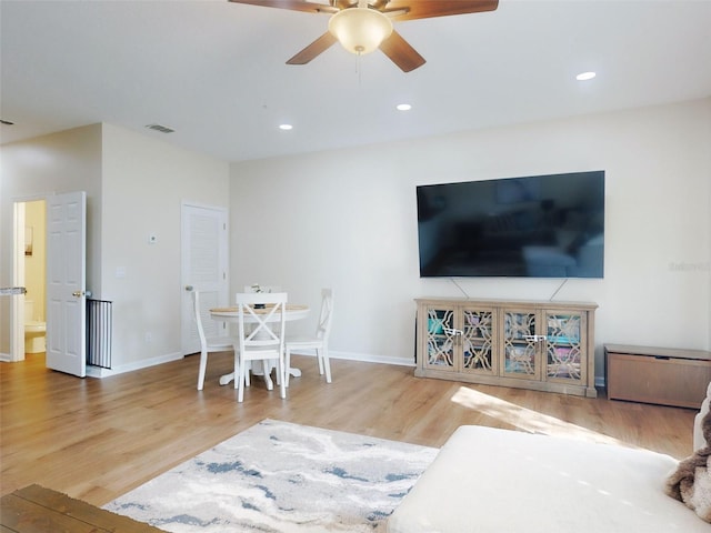 2775 Revolution St Unit 103, Melbourne, FL 32935 - living room featuring recessed lighting, wood finished floors, visible vents, a ceiling fan, and baseboards