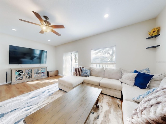 2775 Revolution St Unit 103, Melbourne, FL 32935 - living room featuring wood finished floors, a ceiling fan, recessed lighting, and baseboards