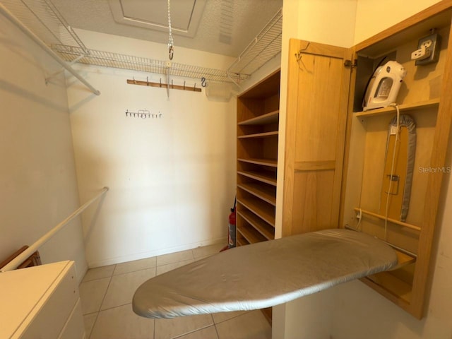 walk in closet featuring light tile patterned floors