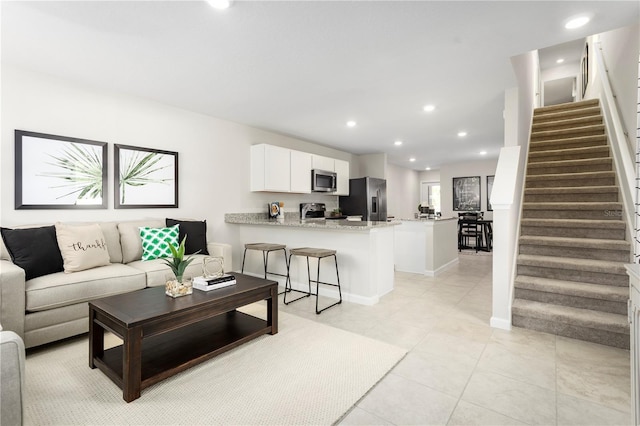 living room featuring light tile patterned floors