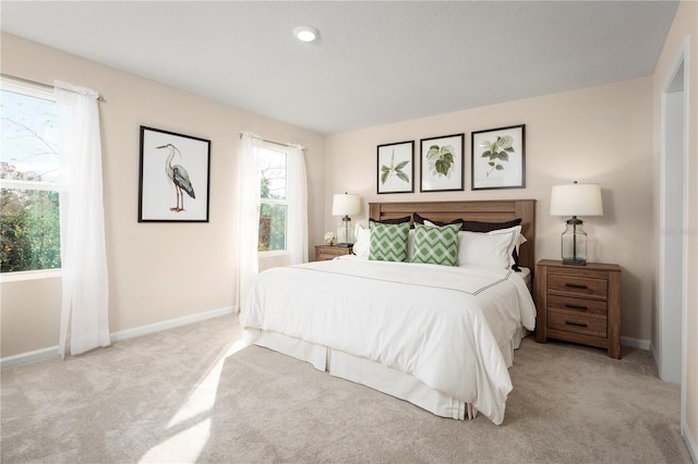 bedroom with light colored carpet