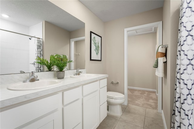 bathroom with a textured ceiling, tile patterned floors, vanity, toilet, and a shower with shower curtain