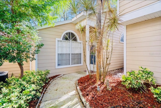 doorway to property featuring central AC unit