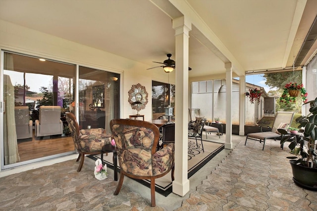 view of patio / terrace featuring ceiling fan and a storage unit