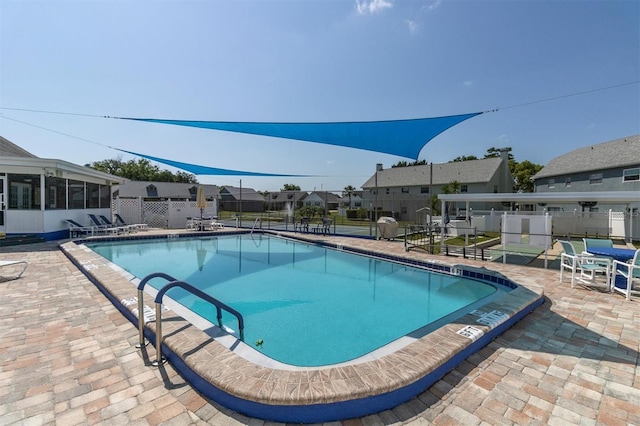 view of swimming pool featuring a patio area