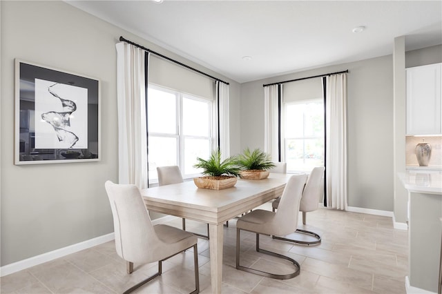 dining room featuring light tile patterned flooring