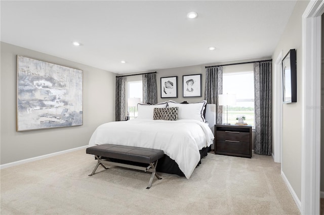 bedroom featuring light carpet