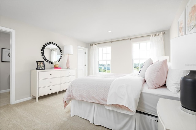 bedroom with light colored carpet