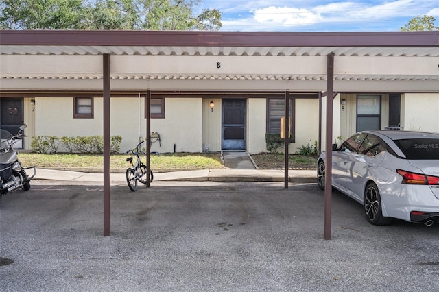 view of car parking featuring a carport