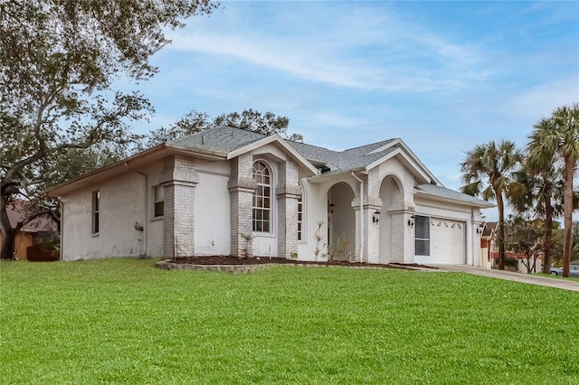 ranch-style house with a garage and a front lawn