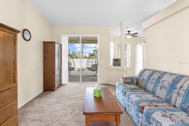 living room with light carpet and ceiling fan