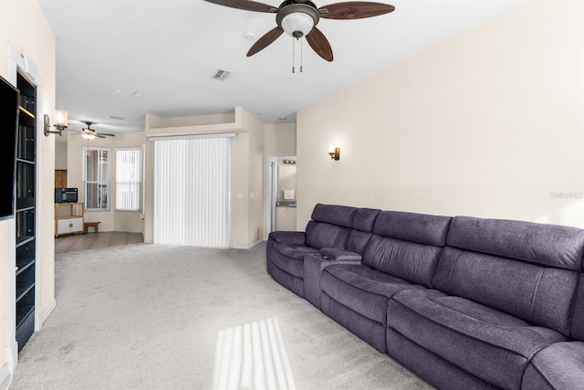 living room featuring ceiling fan and light colored carpet