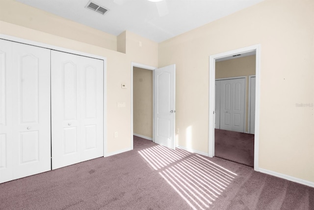 unfurnished bedroom with ceiling fan, a closet, and carpet