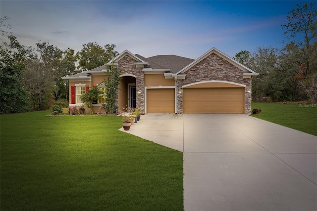 view of front of house featuring a front yard and a garage