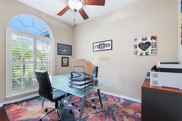 office space with plenty of natural light, hardwood / wood-style flooring, and ceiling fan