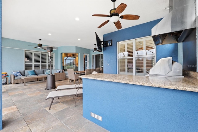 interior space with ventilation hood and ceiling fan