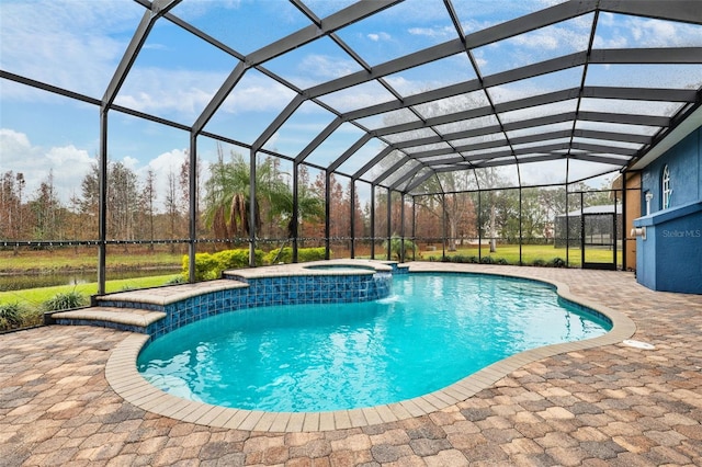 view of swimming pool featuring glass enclosure, an in ground hot tub, and a patio