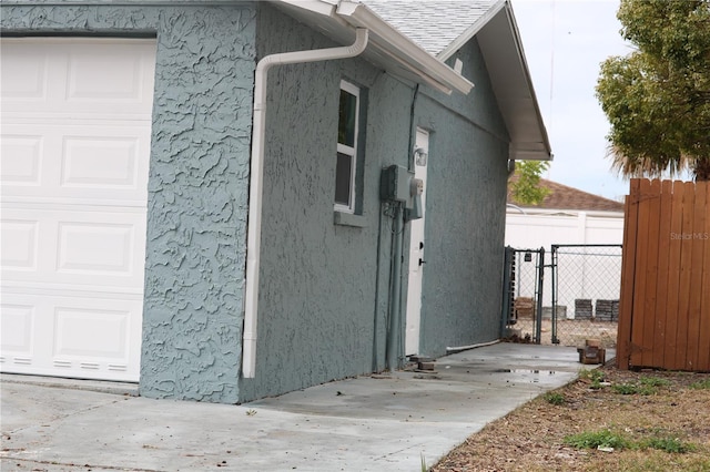 8703 Robilina Rd, Port Richey, FL 34668 - view of home's exterior with a garage