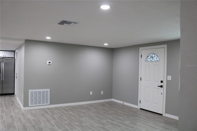 8703 Robilina Rd, Port Richey, FL 34668 - foyer entrance with light hardwood / wood-style flooring