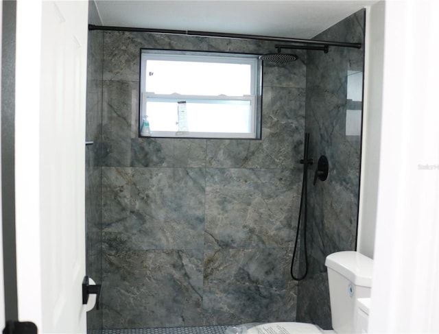 8703 Robilina Rd, Port Richey, FL 34668 - bathroom featuring toilet and a tile shower