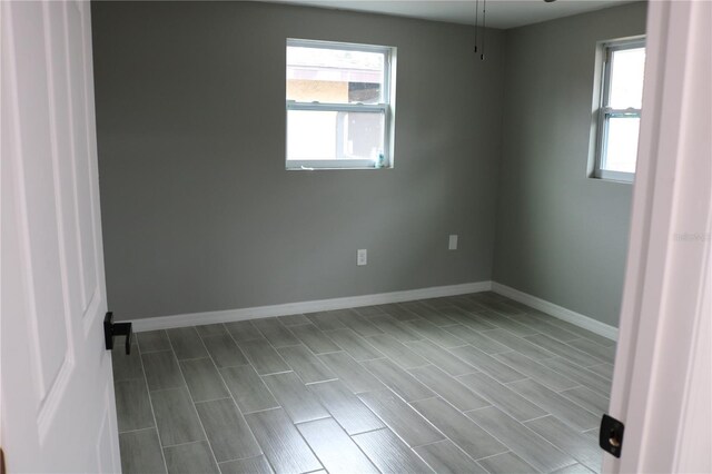 8703 Robilina Rd, Port Richey, FL 34668 - unfurnished room featuring a healthy amount of sunlight
