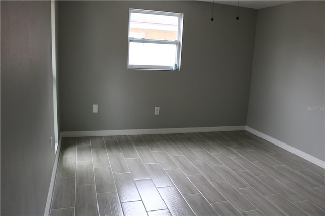 8703 Robilina Rd, Port Richey, FL 34668 - spare room featuring wood-type flooring