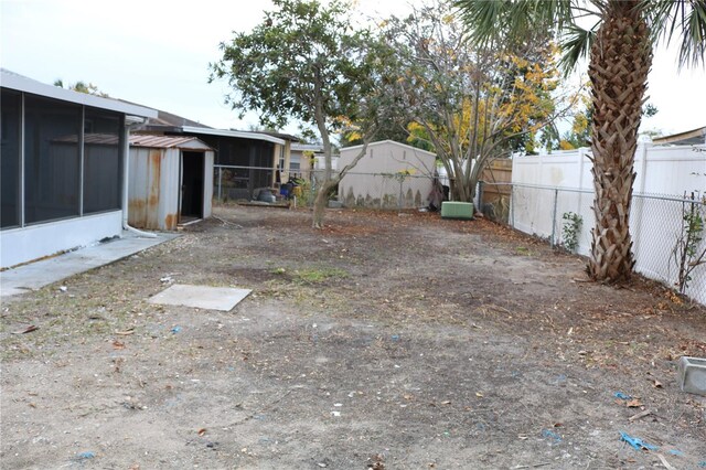 8703 Robilina Rd, Port Richey, FL 34668 - view of yard featuring a sunroom