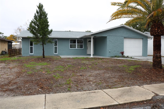 8703 Robilina Rd, Port Richey, FL 34668 - ranch-style house featuring a garage