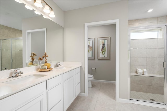 bathroom with a shower with door, tile patterned floors, vanity, and toilet