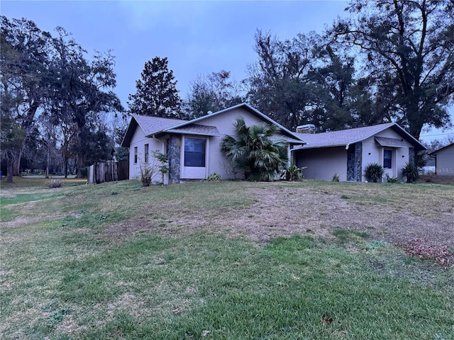 ranch-style house with a front yard