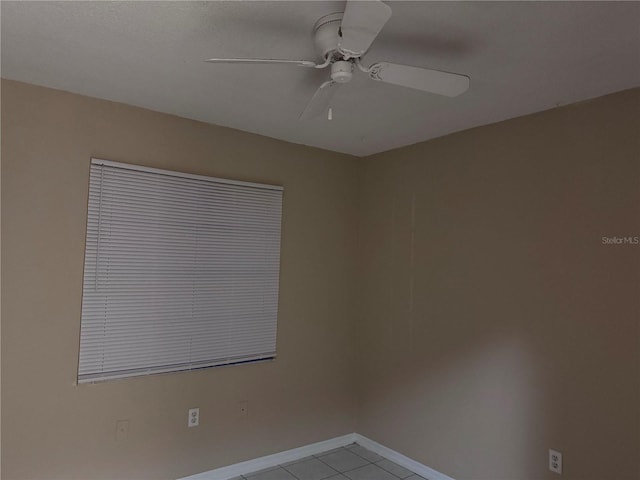 unfurnished room featuring ceiling fan and light tile patterned floors