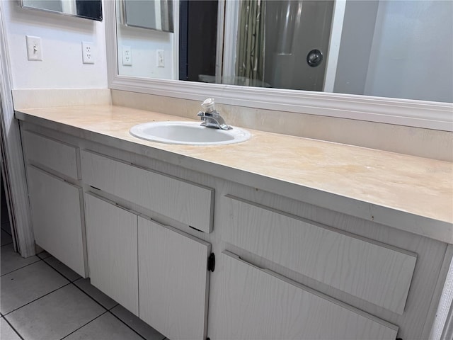 bathroom featuring tile patterned floors and vanity