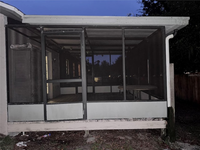 view of side of home featuring a sunroom