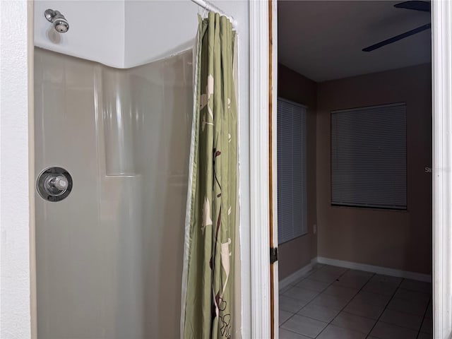 bathroom featuring ceiling fan, walk in shower, and tile patterned floors