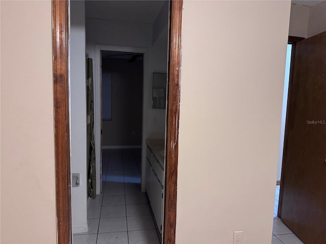 hallway with light tile patterned floors