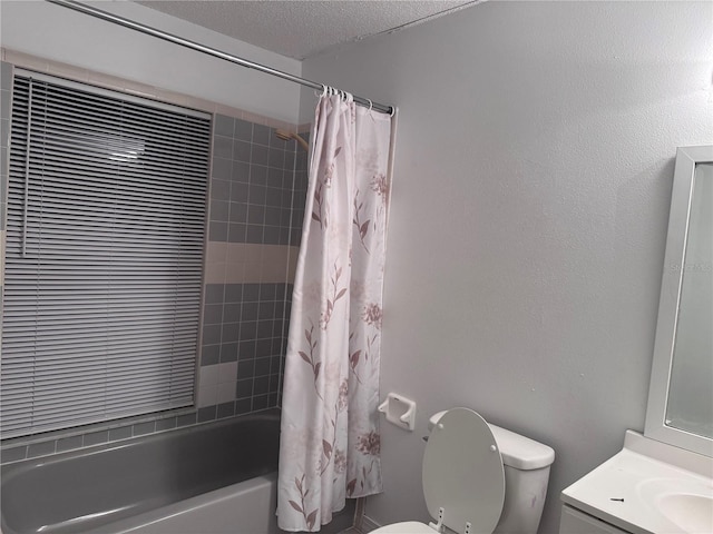 full bathroom featuring a textured ceiling, toilet, vanity, and shower / tub combo with curtain