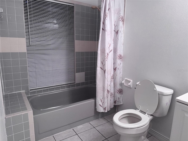 full bathroom with toilet, vanity, shower / bath combo, and tile patterned flooring