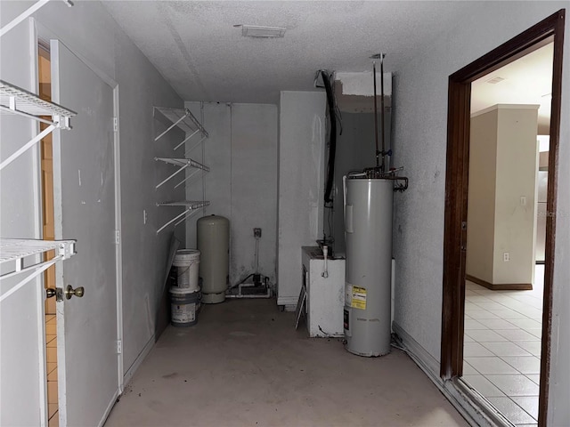 utility room featuring water heater