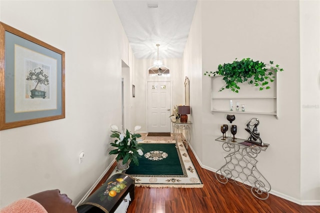 hallway featuring hardwood / wood-style flooring