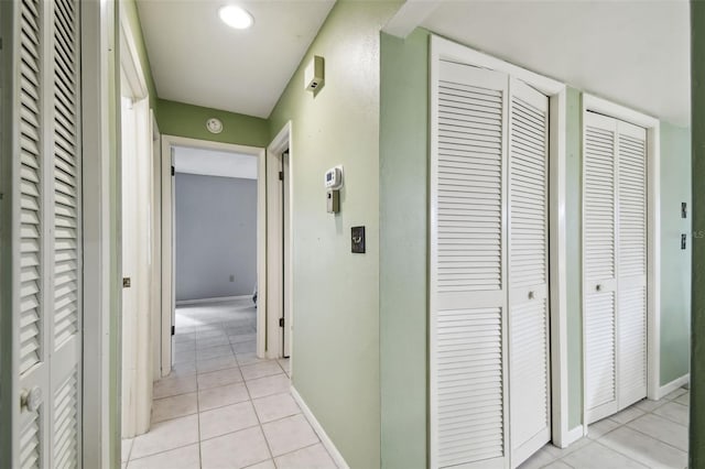 hallway with light tile patterned floors