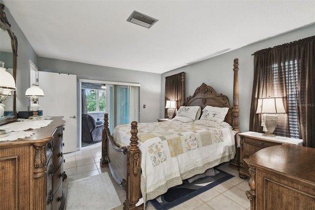 bedroom featuring access to outside and light tile patterned flooring